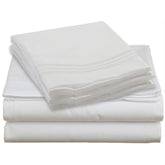 A neatly stacked pile of white sheets resting on a white surface, emphasizing simplicity and uniformity.
